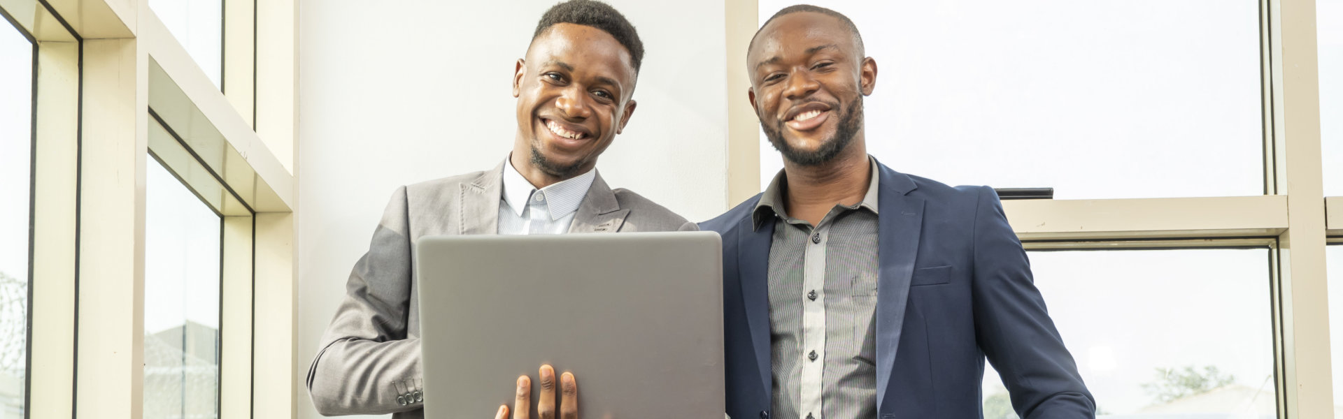 Two male professional smiling together